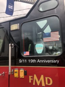 9/11 Flag and faded FDNY Memorial